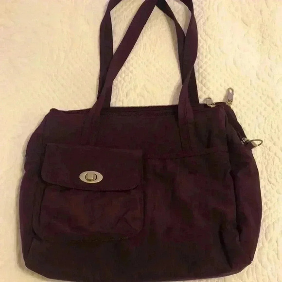 Magellan’s purple nylon shoulder bag. - Picture 1 of 12